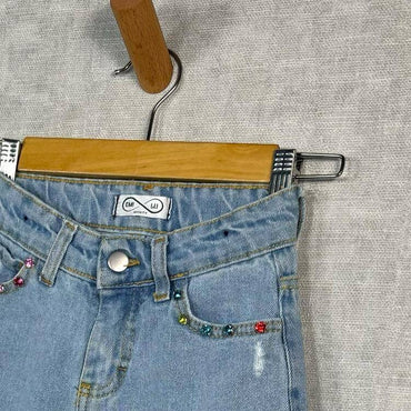 Jeans fille avec pierres précieuses 